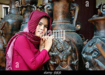 Phan Rang, Viet Nam, beautiful portrait of Cham girl, minority ethnic of Vietnamese, pretty women in traditional dress at unique terracotta, Vietnam Stock Photo