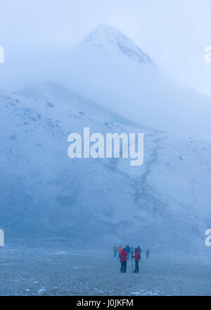 Trekkers on the way to Kala Pattar in the Nepal Himalaya. Photo © robertvansluis.com Stock Photo