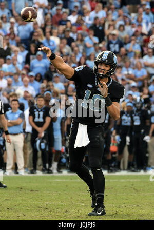 North Carolina Tar Heels quarterback Mitch Trubisky (10) passes during the second half of the game between the North Carolina State Wolfpack and the North Carolina Tar Heels at Kenan Stadium in Chapel Hill, North Carolina. NC State defeated North Carolina 28-21. Stock Photo