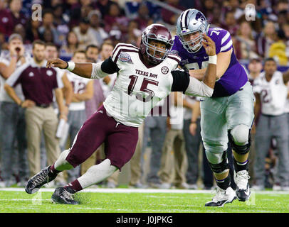Texas A&M Aggies defensive lineman Myles Garrett (15) turns the corner in the second half during the NCAA football game between the Texas A&M Aggies and the Kansas State Wildcats in the Texas Bowl at NRG Stadium. Stock Photo