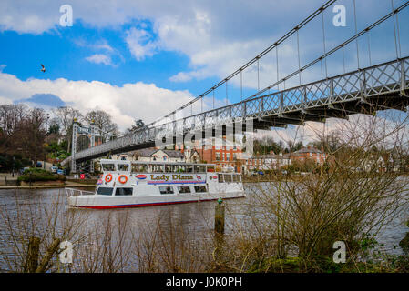 A pleasure boat carrying tourists back to the city passes under the Queen's Park Suspension Bridge in Chester, UK. Picture credit: Brian Hickey/Alamy Stock Photo