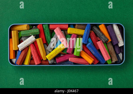 Colorful crayons on red Stock Photo