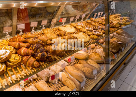 A set of croissants and bread in the shop window