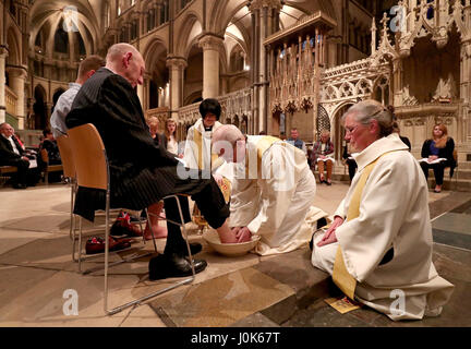 The Archbishop of Canterbury Justin Welby performs the Washing of The Feet ceremony during the Maundy Thursday service at Canterbury Cathedral in Kent. Stock Photo