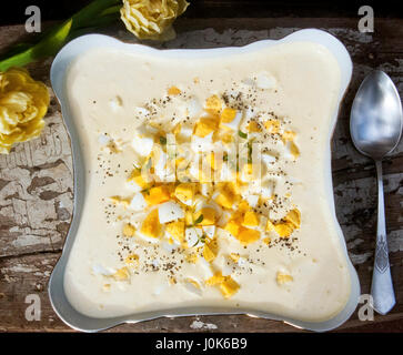 Hard boiled eggs in horseradish sauce. Traditional dish on Polish Easter table. Stock Photo