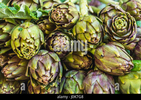Artichokes for sale on a daily outdoor market in Syracuse city, southeast corner of the island of Sicily, Italy Stock Photo