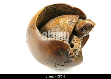 antique Japanese netsuke turtle made of boxwood isolated on white background Stock Photo