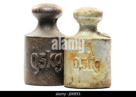 old iron weights isolated on white background Stock Photo