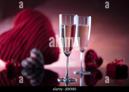 Romantic day concept Glasses  of wine and gifts in the form of hearts Stock Photo