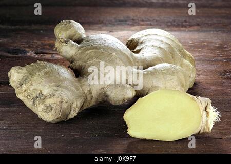 ginger rhizome on wooden background Stock Photo