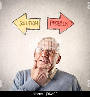 Old man thinking about problem solving Stock Photo