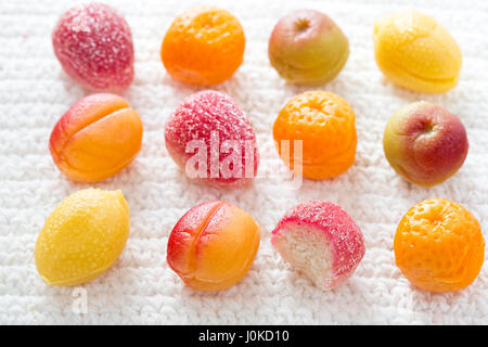 Marzipan fruits - peaches, raspberries, apples and lemons coated in sugar Stock Photo
