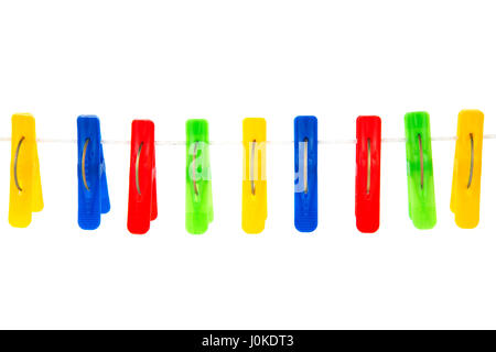 Colored red, yellow, green, blue clothespins hanging on a rope isolated on white background Stock Photo