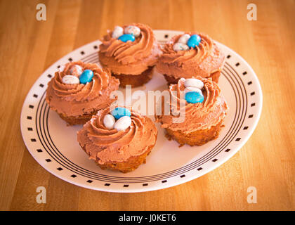 Cupcakes for Holidays Birds eggs on a plate frosting Stock Photo