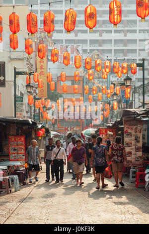 Kuala Lumpur, Malaysia - March 17, 2016: People walking through Petaling Street in Chinatown during the morning hour, Kuala Lumpur, Malaysia on March  Stock Photo