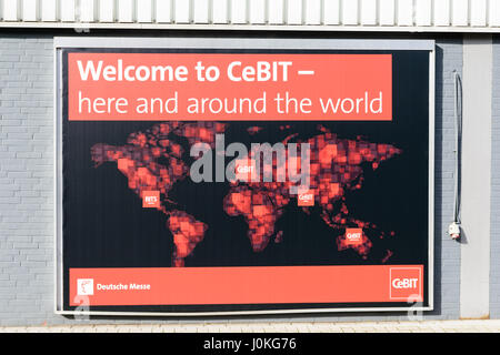 Hannover, Germany - March 22, 2017: A poster of the CeBIT at a wall inside the trade fair ground advertises for CeBIT events worldwide. Stock Photo