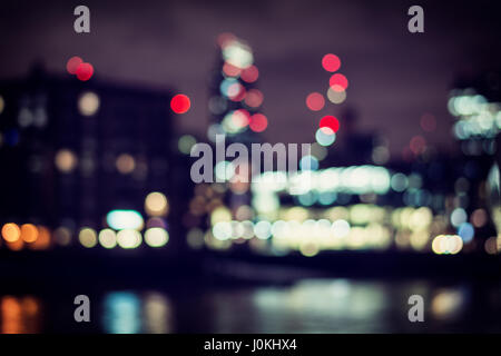 Blurred city and river at night Stock Photo