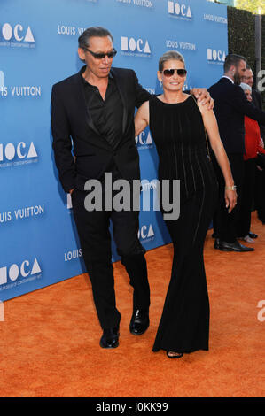 Musician Alex Van Halen and Stine Schyberg (r) arrive at the 2015 MOCA Gala presented by Louis Vuitton at The Geffen Contemporary at MOCA on May 30, 2015 in Los Angeles, California. Stock Photo