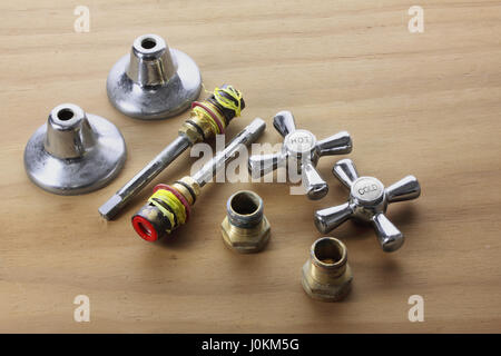 Taps and Accessories on Wooden Background Stock Photo
