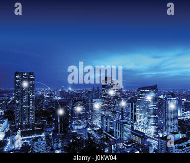 Network and Connection Technology Concept of Bangkok Downtown at night, Skyscrapers, Thailand Stock Photo