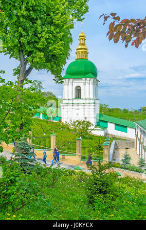 KYIV, UKRAINE - MAY 2, 2016: The view on Belfry in the Middle Caves through the Kyiv Pechersk Lavra Cave Monastery garden Stock Photo