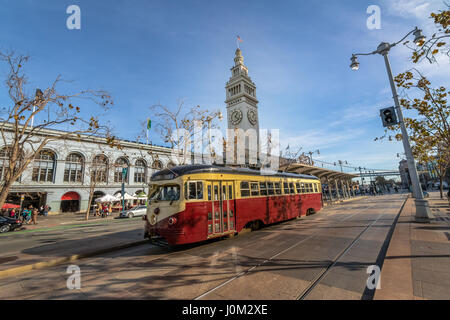 Street car or trollley or muni tram in front of San Francisco Ferry Building in Embarcadero - San Francisco, California, USA Stock Photo