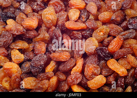 Background texture of dried raisins. Close-up, full frame. Stock Photo