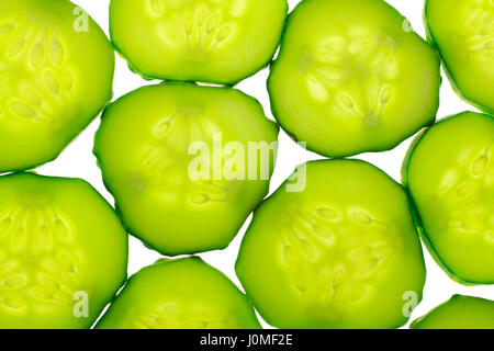 Cucumber slices close up view. Backlight, full frame. Stock Photo