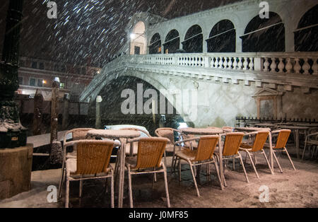 Rialto Bridge during an heavy snow in Venice. Stock Photo