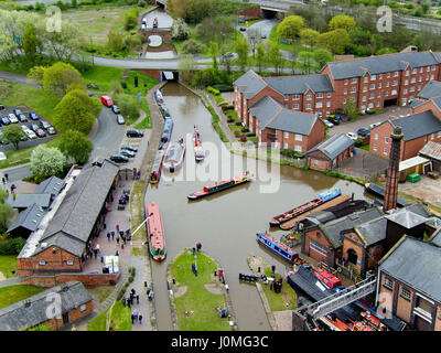 Boats travel along the Shropshire Union Canal as they arrive at the 40th Boat Gathering at the National Waterways Museum in Ellesmere Port in Cheshire Stock Photo