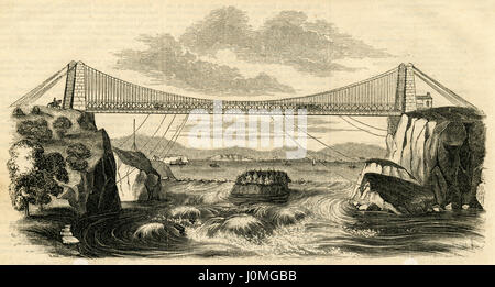 Antique 1854 engraving, 'View of the Suspension Bridge over the River St. John, New Brunswick.' The first road bridge was built over Reversing Falls on the Saint John River in 1853. SOURCE: ORIGINAL ENGRAVING. Stock Photo