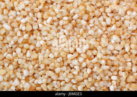 Barley groats close up. Full frame shoot. Stock Photo