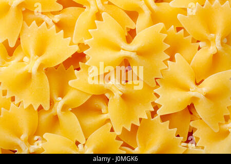 Raw farfalle pasta. Full frame, top view. Stock Photo