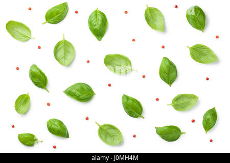 Basil leaves with red peppercorns isolated on white background. Top view. Flat lay Stock Photo