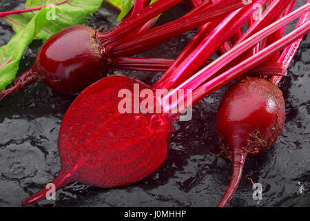 Fresh red beetroot on black painted stone Stock Photo