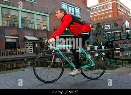 Paul Hudson on his bike in Birmingham in front of the Town Hall and riding along the canals. Stock Photo