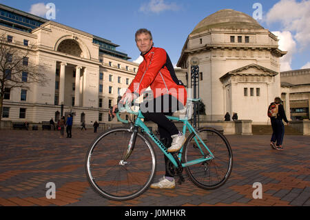 Paul Hudson on his bike in Birmingham in front of the Town Hall and riding along the canals. Stock Photo