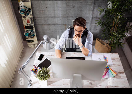 Freelance developer and designer working on computer Stock Photo