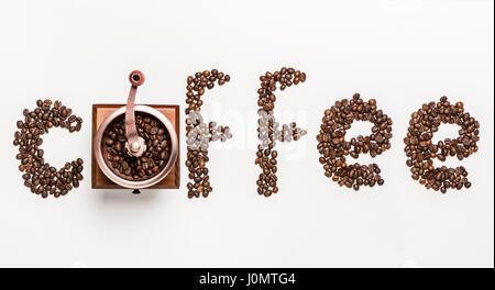 Top view of word coffee made from coffee beans and coffee mill Stock Photo