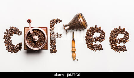 Top view of word coffee made from coffee beans and coffee mill with turkish coffee pot Stock Photo