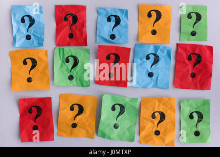 Question marks. Colorful paper notes with question marks. Concept image. Closeup. Stock Photo