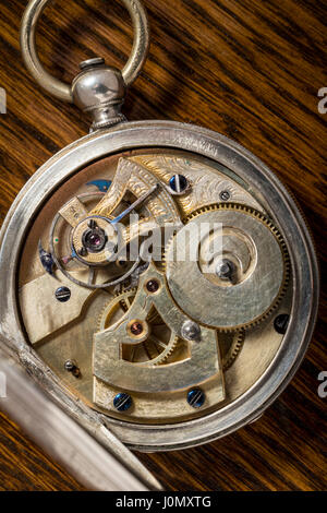 Detail of precise mechanism in antique Ami Sandoz & Fils Swiss hand carved Duplex Escapement style silver pocket watch c 1860 Stock Photo