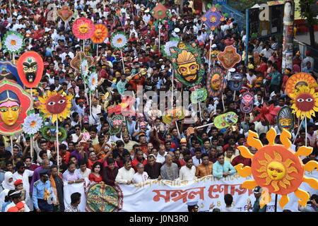 Dhaka. 14th Apr, 2017. Bangladeshi people march to celebrate the Bengali New Year on April 14, 2017 in Dhaka, capital of Bangladesh. Tens of thousands of people wearing traditional dresses joined a colorful procession, the Mangal Shobha Jatra, to welcome the Bengali New Year 1424 with good spirits in Bangladesh capital Dhaka on Friday morning. Credit: Jibon Ahsan/Xinhua/Alamy Live News Stock Photo