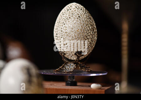 An artfully punctured Easter egg by artist Herbert Kober is on display in the city hall at the art market in Wangen im Allgaeu, Germany, 18 March 2017. Kober uses a needle to puncture and create patterns on the eggshells. Photo: Felix Kästle/dpa Stock Photo