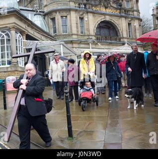 Buxton, Derbyshire 14th April 2017 Christians in Buxton celebrate Good Friday with a Walk of Witness from the Parish Church of St John to the pedestrianised shopping centre. They stop four times for hymns and reading from St Mark's Gospel. Christians throughout the world celebrate Good Friday as the day when Jesus Christ was crucified, before rising again on Easter Sunday. Credit: John Fryer/Alamy Live News Stock Photo