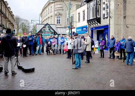 Buxton, Derbyshire 14th April 2017 Christians in Buxton celebrate Good Friday with a Walk of Witness from the Parish Church of St John to the pedestrianised shopping centre. They stop four times for hymns and reading from St Mark's Gospel. Christians throughout the world celebrate Good Friday as the day when Jesus Christ was crucified, before rising again on Easter Sunday. Credit: John Fryer/Alamy Live News Stock Photo