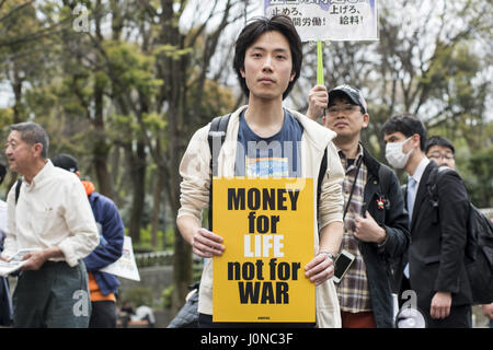 Tokyo, Tokyo, Japan. 15th Apr, 2017. Protester hold placards demanding a higher wage in Tokyo April 15, 2017, Japan. a A Group of young people by name Aequitas means Equity in Latin, organized a demonstration to demanded a minimum hourly wage of 1,500 JPY (approx. USD 13.7), currently the minimum wage ranges from 700 to 900 JPY (approx. USD from 6, 4 to 8, 3) Credit: Alessandro Di Ciommo/ZUMA Wire/Alamy Live News Stock Photo