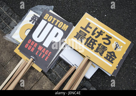 Tokyo, Tokyo, Japan. 15th Apr, 2017. Placards demanding a higher wage in Tokyo April 15, 2017, Japan. a A Group of young people by name Aequitas means Equity in Latin, organized a demonstration to demanded a minimum hourly wage of 1,500 JPY (approx. USD 13.7), currently the minimum wage ranges from 700 to 900 JPY (approx. USD from 6, 4 to 8, 3) Credit: Alessandro Di Ciommo/ZUMA Wire/Alamy Live News Stock Photo