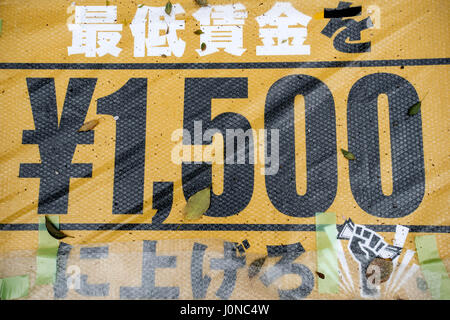 Tokyo, Tokyo, Japan. 15th Apr, 2017. Placards demanding a higher wage in Tokyo April 15, 2017, Japan. a A Group of young people by name Aequitas means Equity in Latin, organized a demonstration to demanded a minimum hourly wage of 1,500 JPY (approx. USD 13.7), currently the minimum wage ranges from 700 to 900 JPY (approx. USD from 6, 4 to 8, 3) Credit: Alessandro Di Ciommo/ZUMA Wire/Alamy Live News Stock Photo