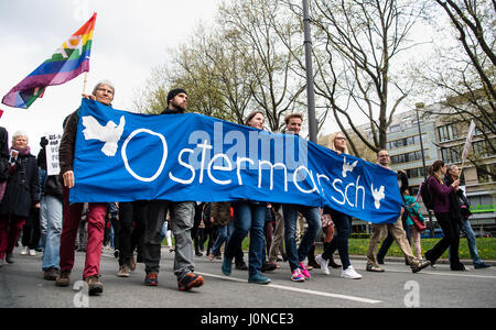 Munich, Germany. 15th Apr, 2017. Members of the peace movement carry a banner with the inscription 'Easter March' during the Easter March in Munich, Germany, 15 April 2017. By holding Easter Marches throughout the german federal state of Bavaria, the protesters aim to raise awareness about regions across the world afflicted by war and crisis and to warn about the increasingly tense global political situation. Photo: Matthias Balk/dpa/Alamy Live News Stock Photo